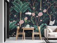 Floral wall mural with pink flowers and brown vines behind a wooden dining set.