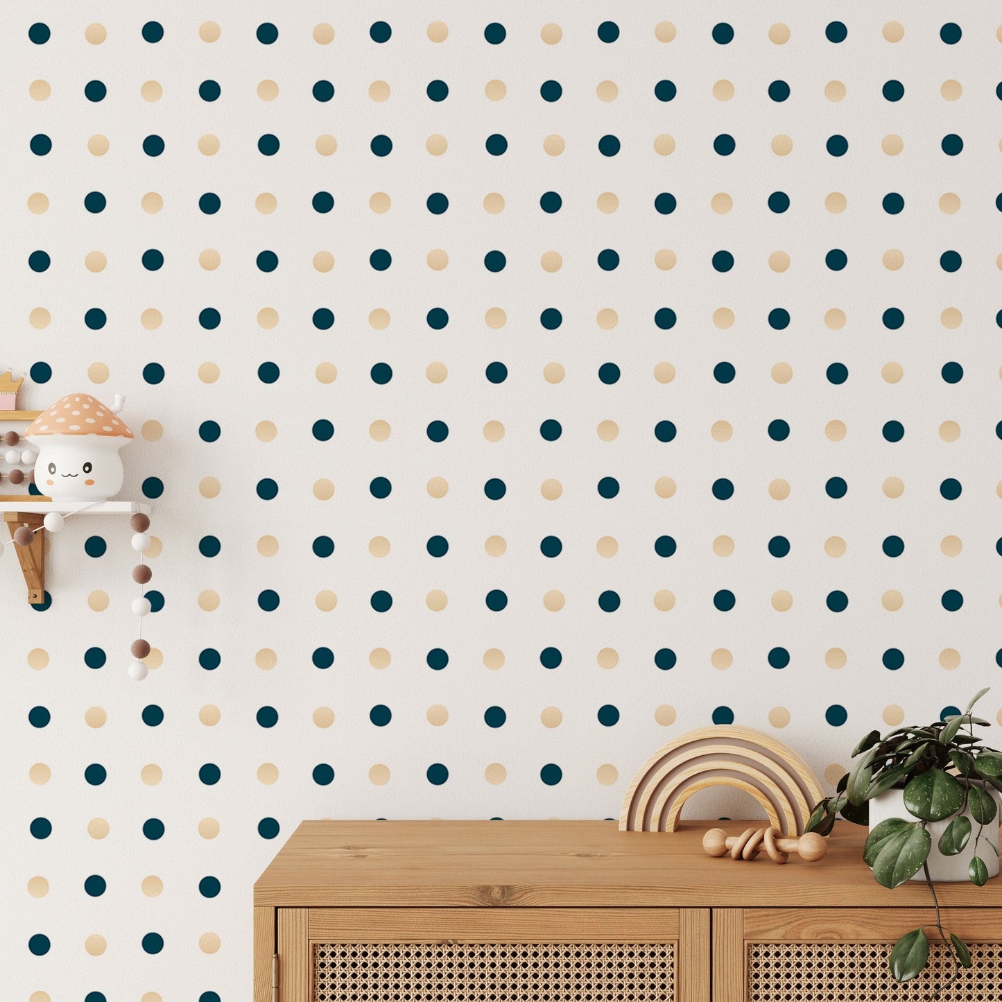 Polka dot pattern wallpaper behind a wooden console table and small plants.