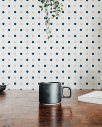 Dotted Patterned wallpaper on a dining room wall with a dark ceramic mug.