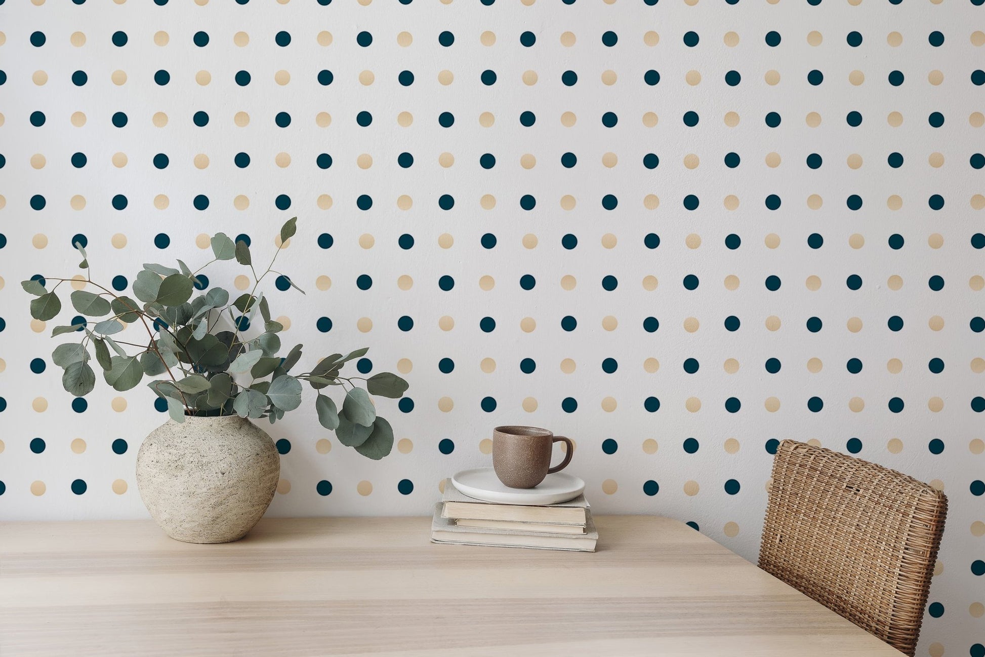 Wallpaper with navy and gold circles behind a wooden dining table.