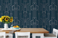 Blue and silver wallpaper in a dining room with white chairs and sunflowers.