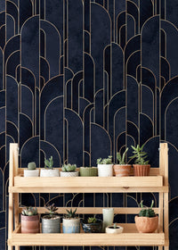 Patterned deco wallpaper behind a wooden plant stand with small succulents.