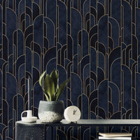 Sophisticated dark blue Deco adhesive wallpaper behind black marble table.