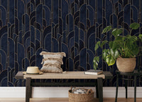 Geometric deco wallpaper behind a wooden bench and indoor green plants.