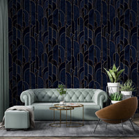 Art Deco wallpaper behind a mint green sofa in a living room.