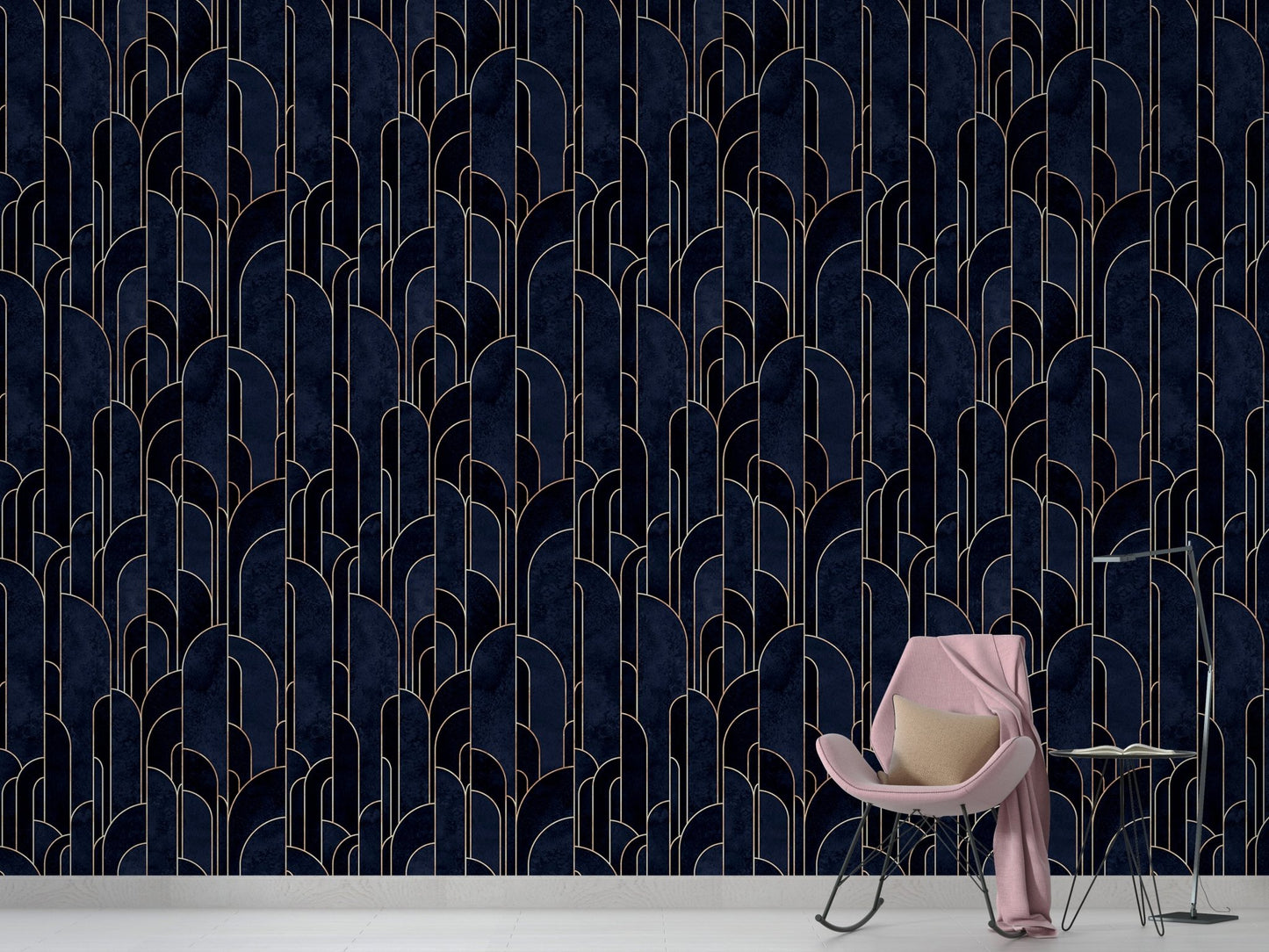 Navy blue geometric wallpaper in a minimalist room with a pink chair.