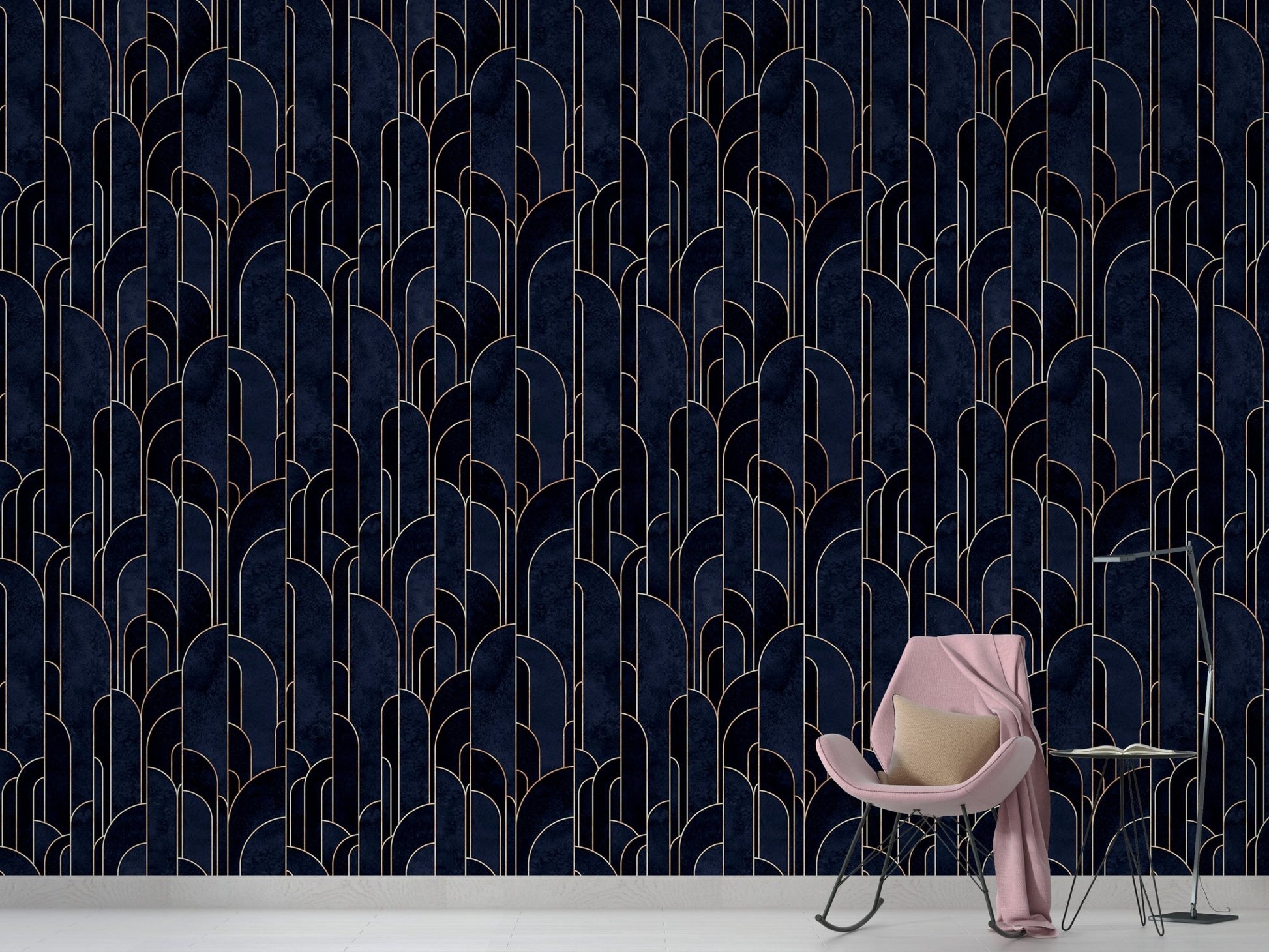 Navy blue geometric wallpaper in a minimalist room with a pink chair.