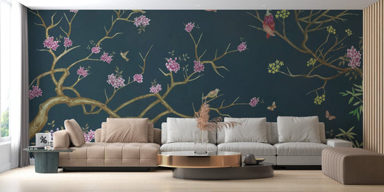 Dark blue chinoiserie wallpaper mural with pink flowers and birds.