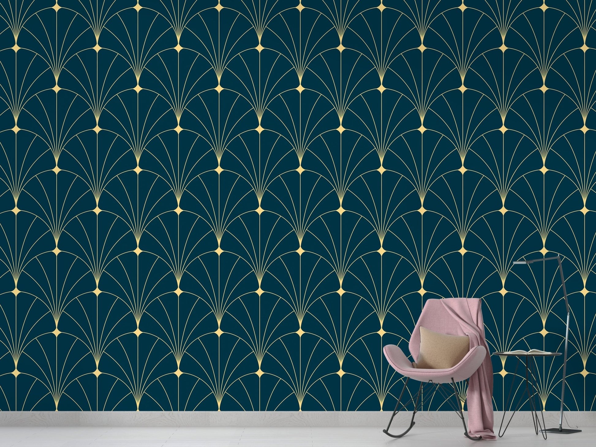 Modern geometric deco wallpaper behind a pink velvet chair and small side table.