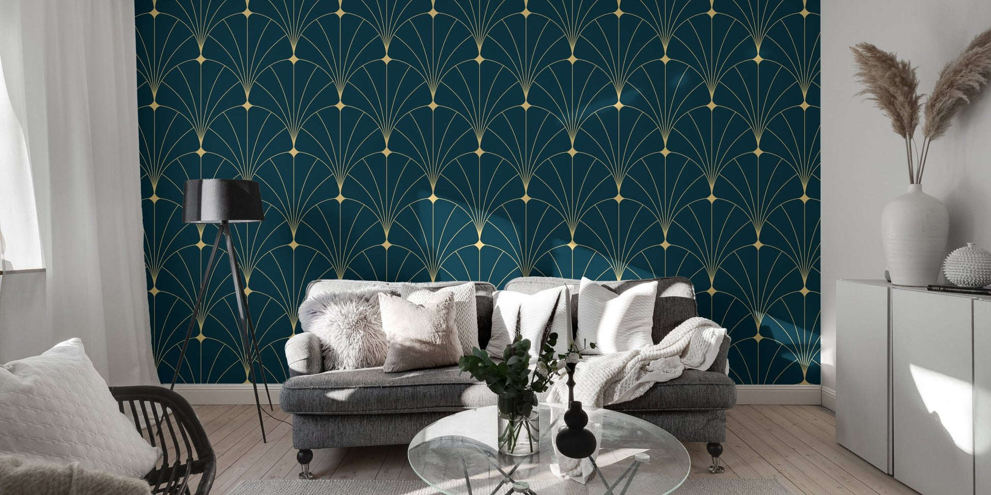 Gold arch pattern wallpaper behind a modern grey couch and glass coffee table.