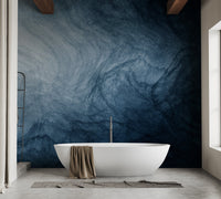 Dark blue liquid fluid texture wallpaper in a modern bathroom with white tub.