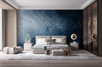 Liquid marble effect wallpaper in a spacious modern bedroom setting.