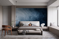 Abstract navy liquid wallpaper in a luxury master bedroom suite.