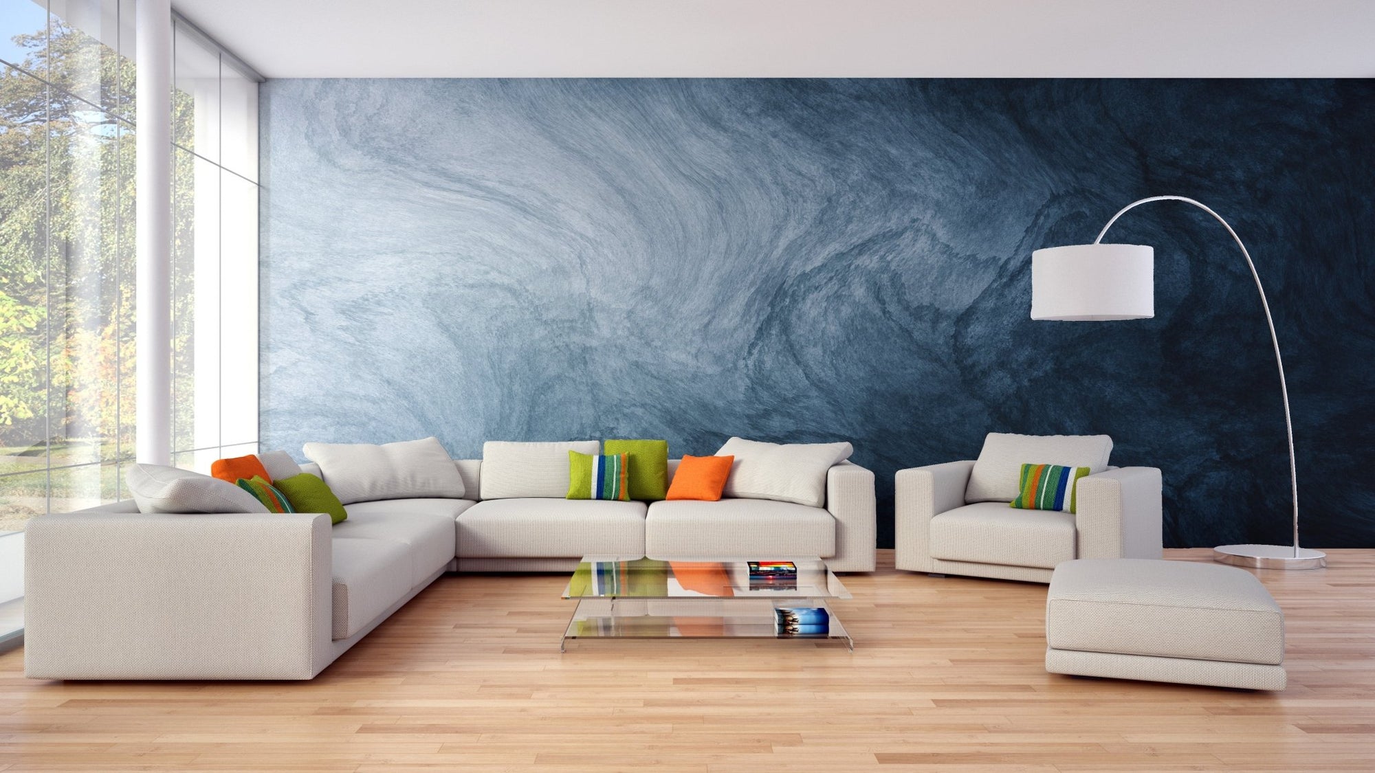 Blue fluid texture wallpaper behind a white sectional sofa in a living area.
