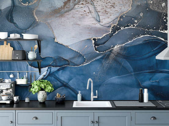 Contemporary kitchen workspace with a sink and marble effect wall mural.