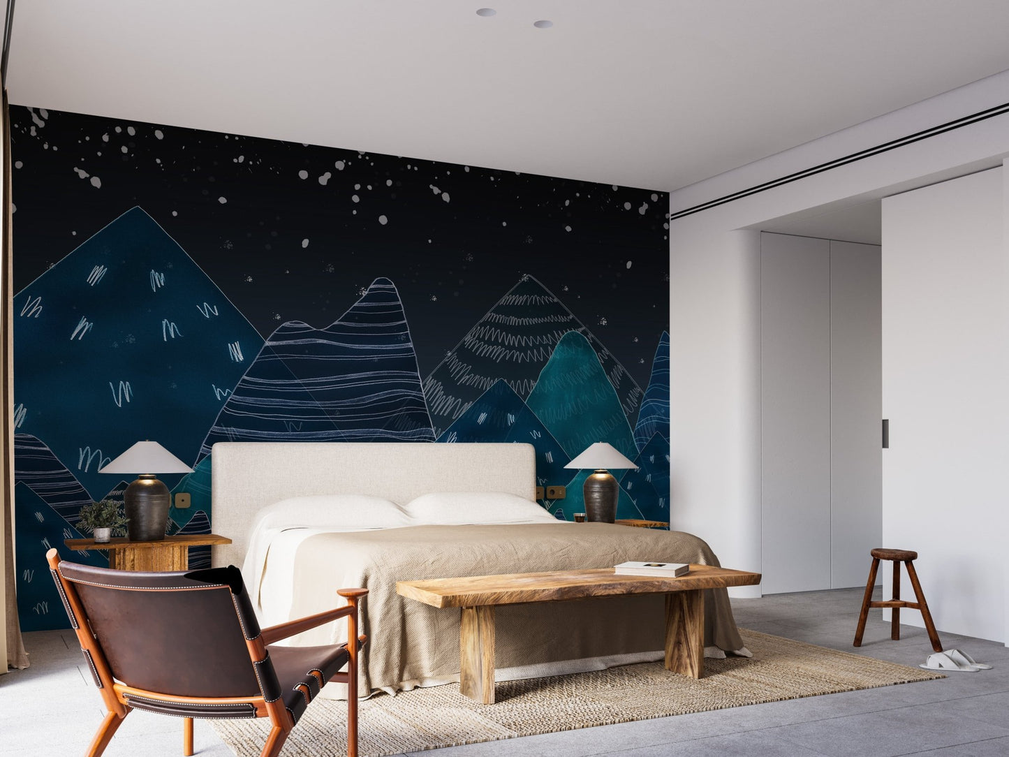 Minimalist bedroom featuring a dark blue mountain mural on the back wall