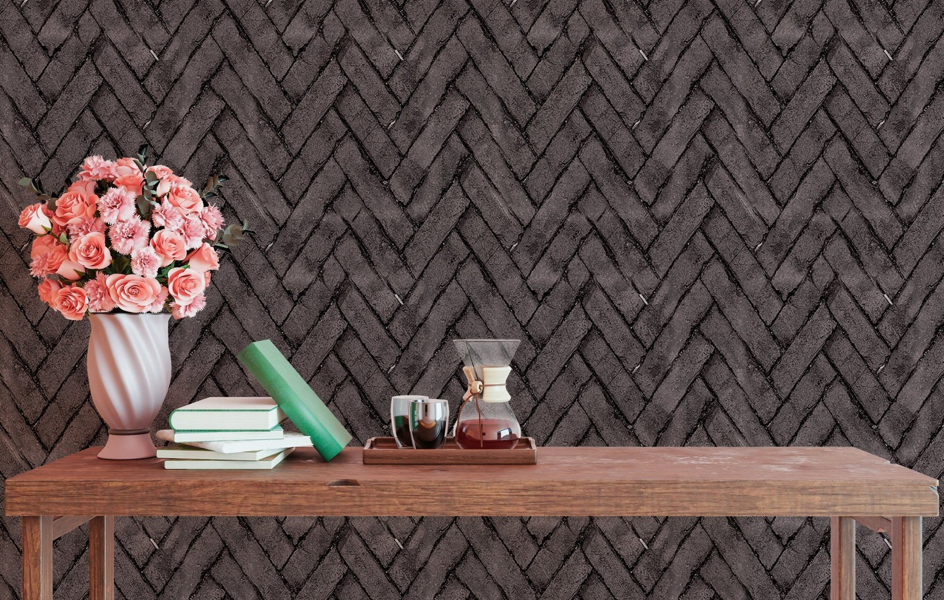 Dark brown brick wallpaper in a study space with a wooden table and pink flowers.