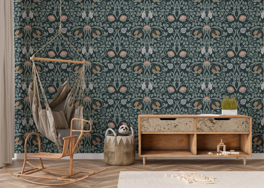 Dark floral wall mural with botanical pattern in a kids room with rocking chair.