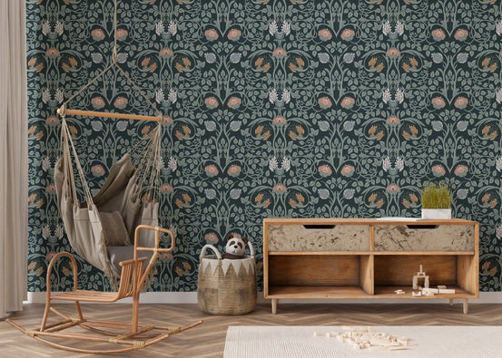 Dark floral wall mural with botanical pattern in a kids room with rocking chair.