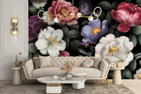 Modern living room with beige sofa and large floral wall mural.