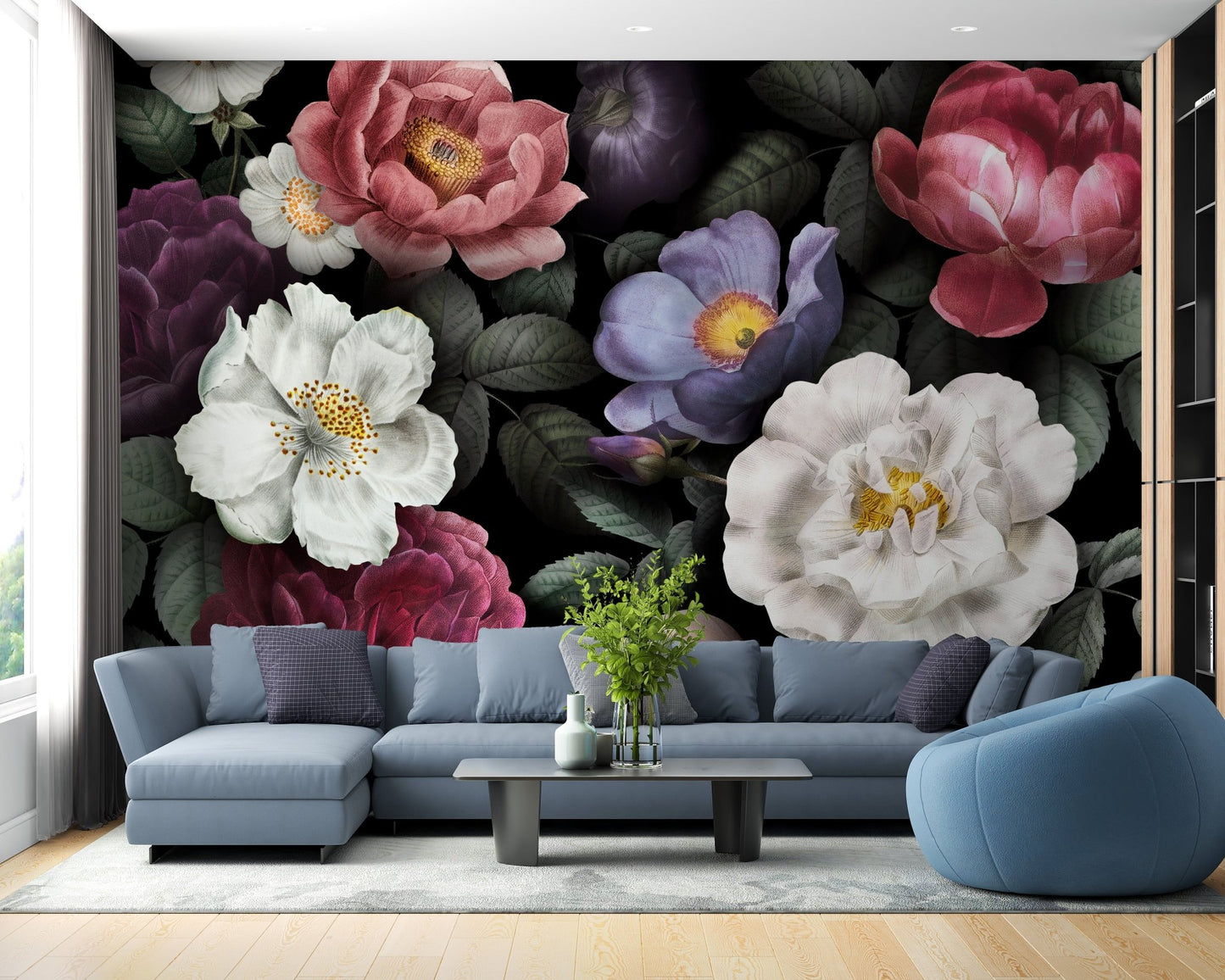 Blue sectional sofa paired with dark botanical wall mural in contemporary home.