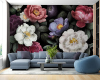 Blue sectional sofa paired with dark botanical wall mural in contemporary home.