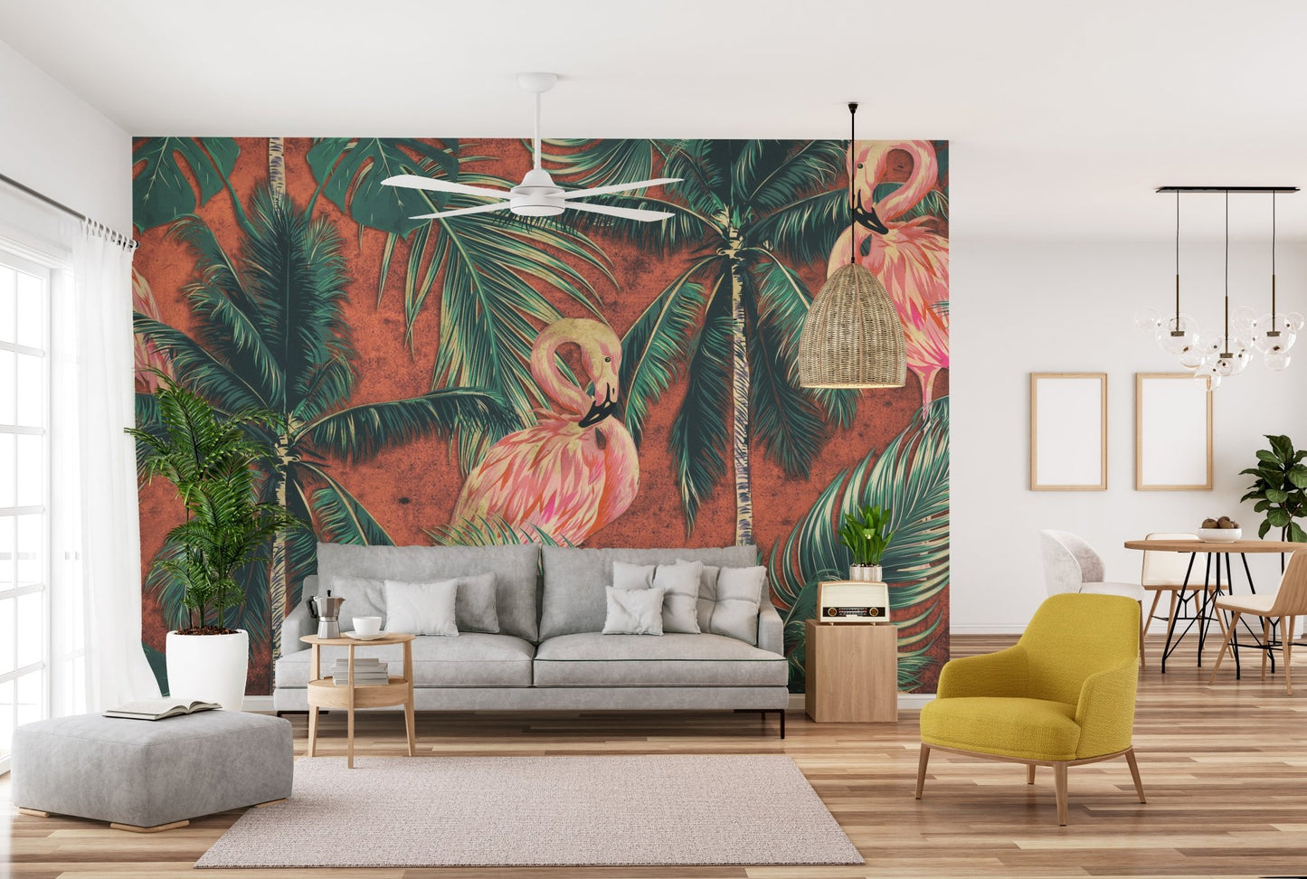 Large tropical wall mural behind a grey sofa and yellow armchair in a living area.