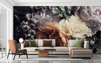 Contemporary living area with dark floral wall mural and leather chair.