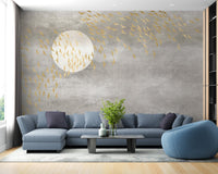 Blue corner sofa with golden bird silhouette wall mural on a grey backdrop.