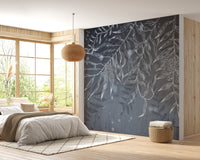 Nature inspired gray wall mural in a bright bedroom with large windows.