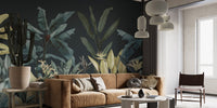 Botanical oasis wall mural in a living area with a tan leather sofa and grey accents.