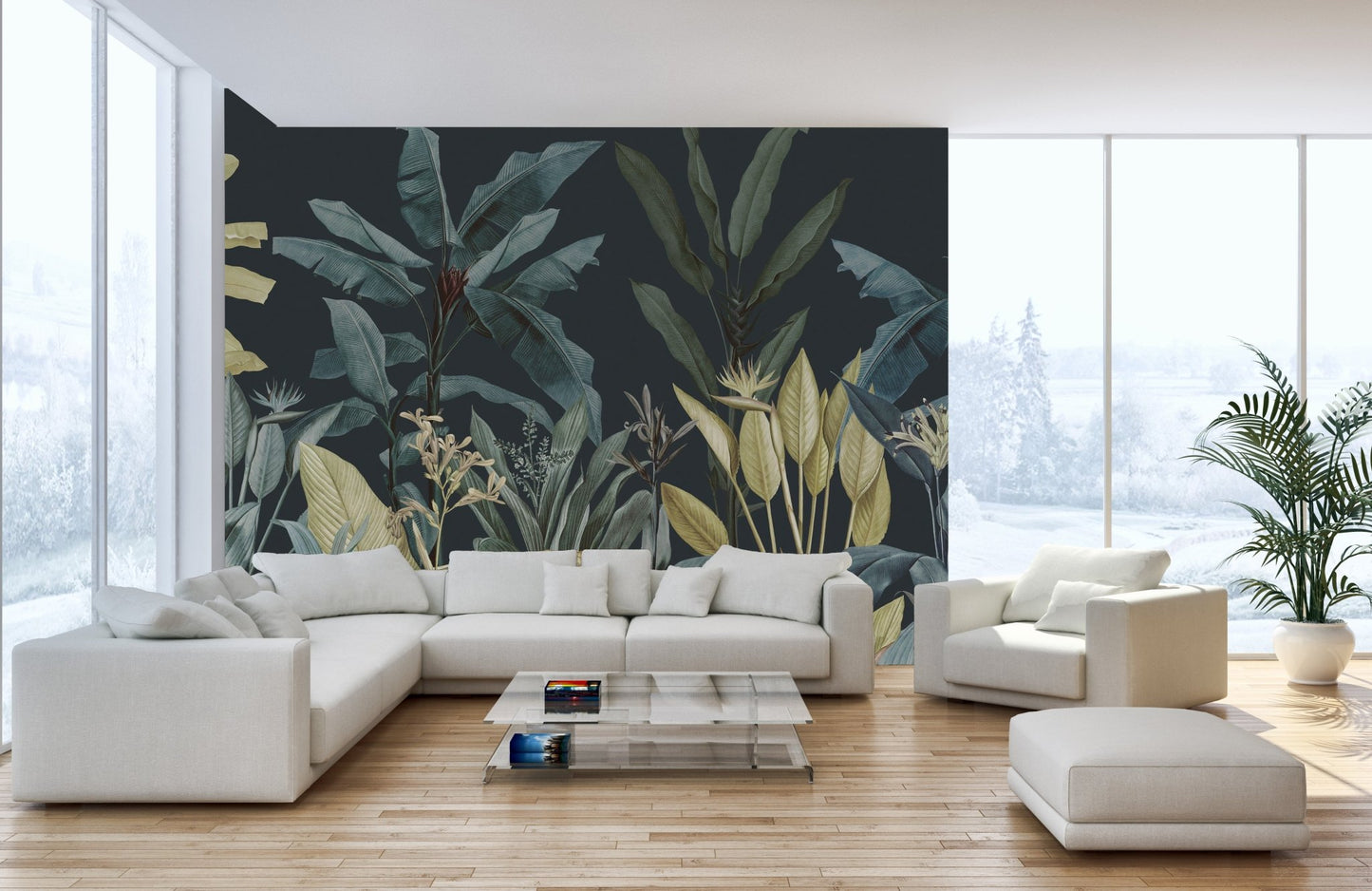 Tropical oasis leaf wall mural behind a large white corner couch and wooden floor.