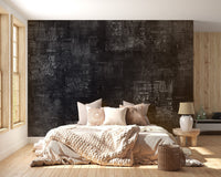 Grungy black newspaper textured wall mural in a minimalist bedroom