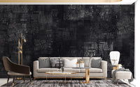 Charcoal grey newsprint wall mural in a lounge area.
