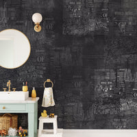 Vintage newsprint style wall mural in a bathroom.