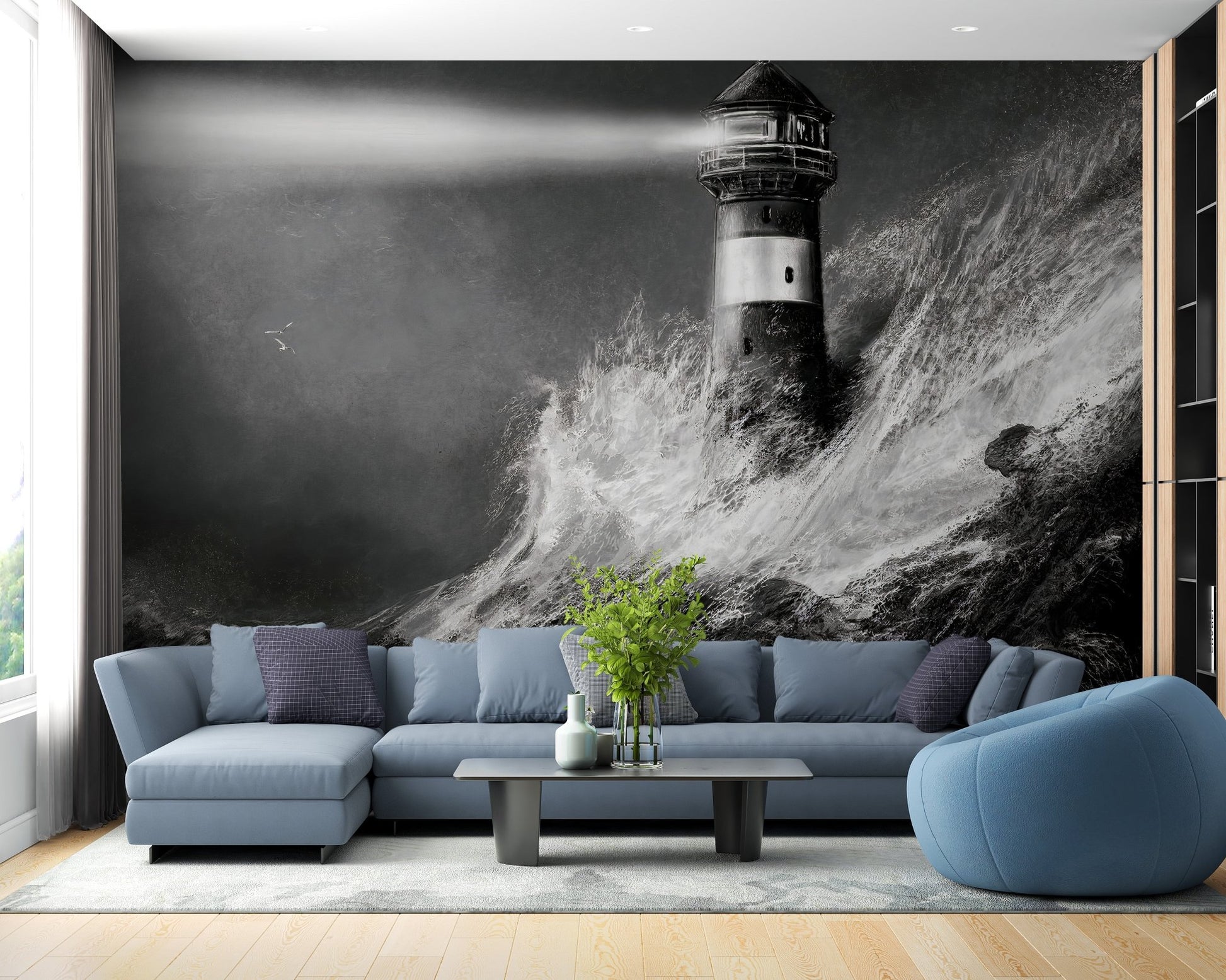 Dark Night Lighthouse Wall mural in living area featuring blue sofa and wooden flooring.