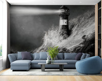 Dark Night Lighthouse Wall mural in living area featuring blue sofa and wooden flooring.