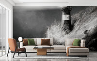 Monochromatic lighthouse wall mural in living room with large L-shaped sectional sofa.