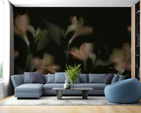 Blue l-shaped sectional sofa set against a black jasmine wall mural.