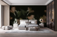 Dark vintage jasmine flower wall mural behind a grey bed in a modern bedroom.