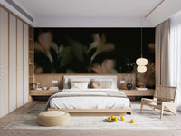 Modern bedroom featuring a dark floral wall mural and light wood furniture.