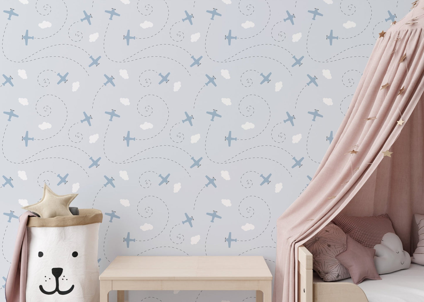 Soft blue pattern wallpaper for a kids room feature wall.