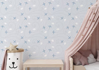 Soft blue pattern wallpaper for a kids room feature wall.