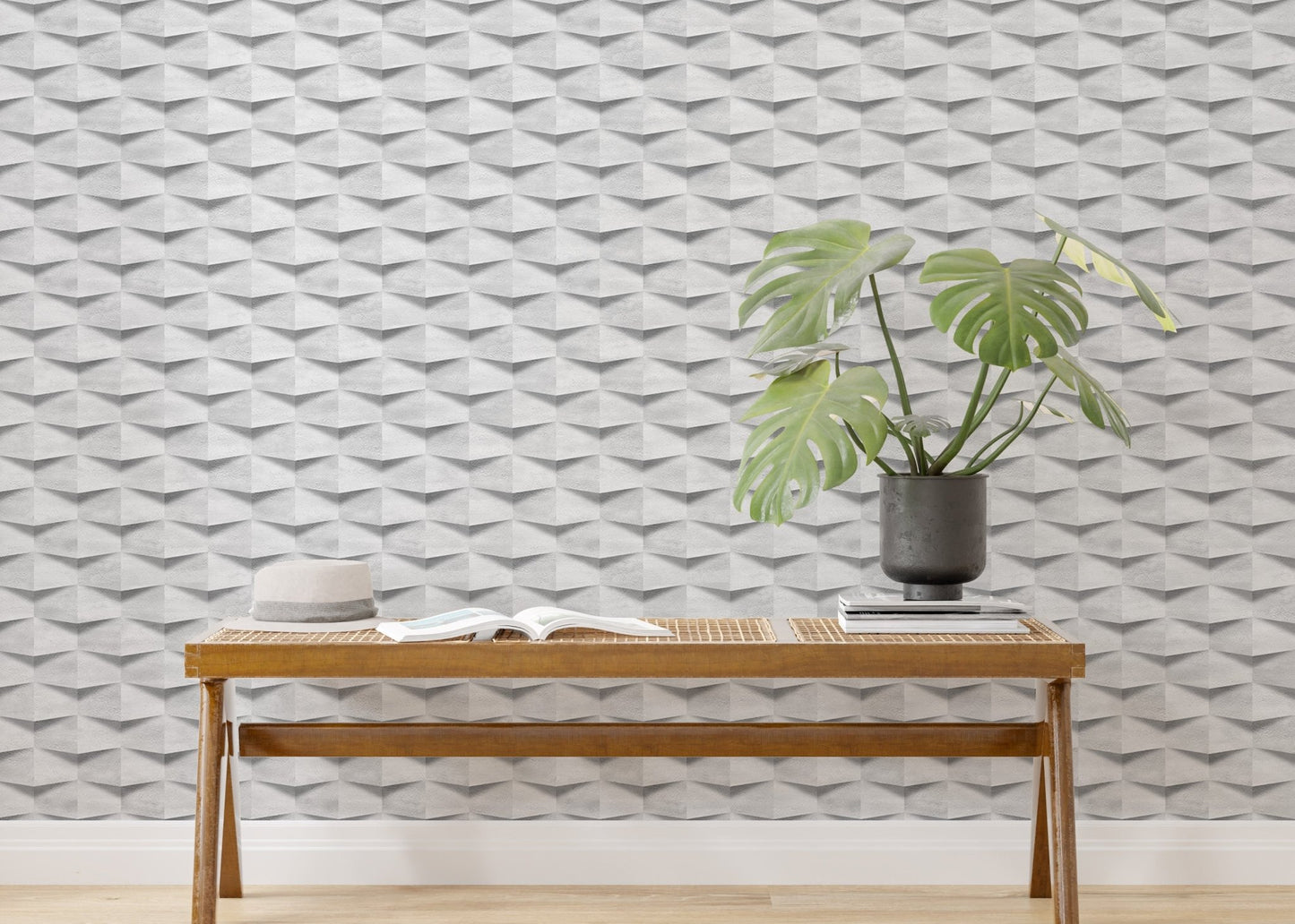 Modern wooden bench with a green plant against a white geometric wallpaper.