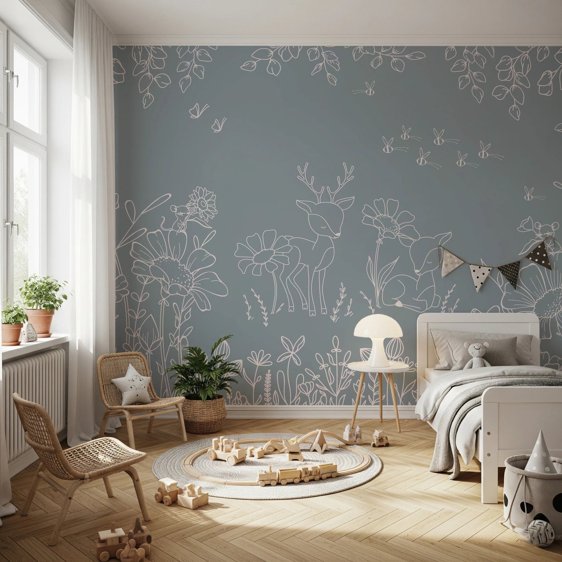 Modern blue wall mural in a bright bedroom with a white crib.
