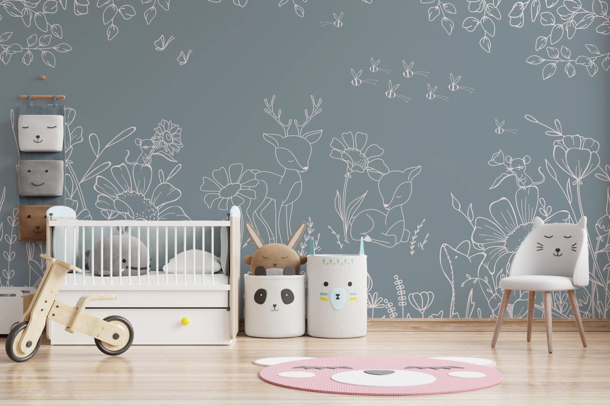 Blue wall mural with floral doodles in a contemporary nursery setting.