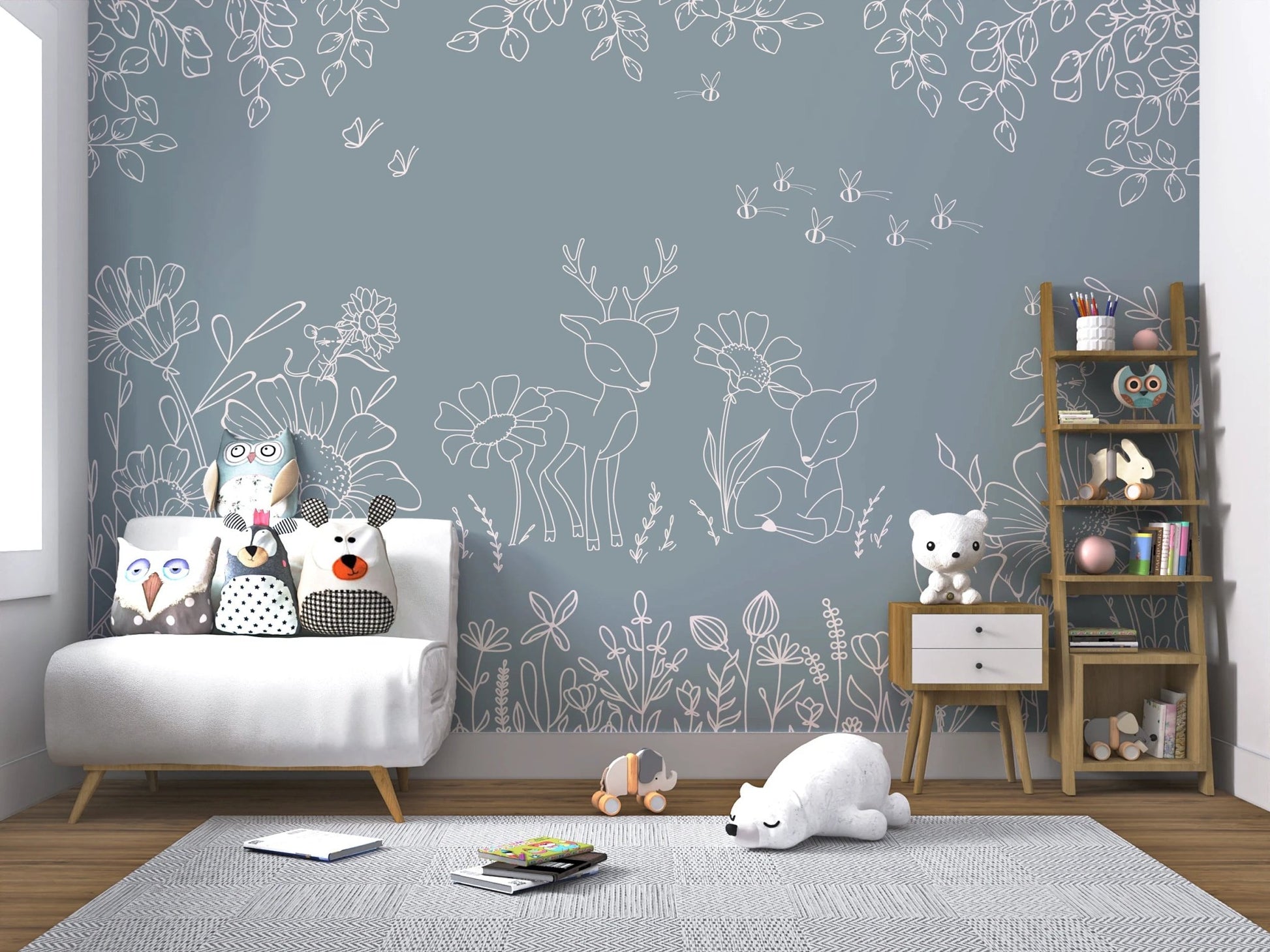 Blue Floral wall mural behind a white sofa and wooden toy shelf.
