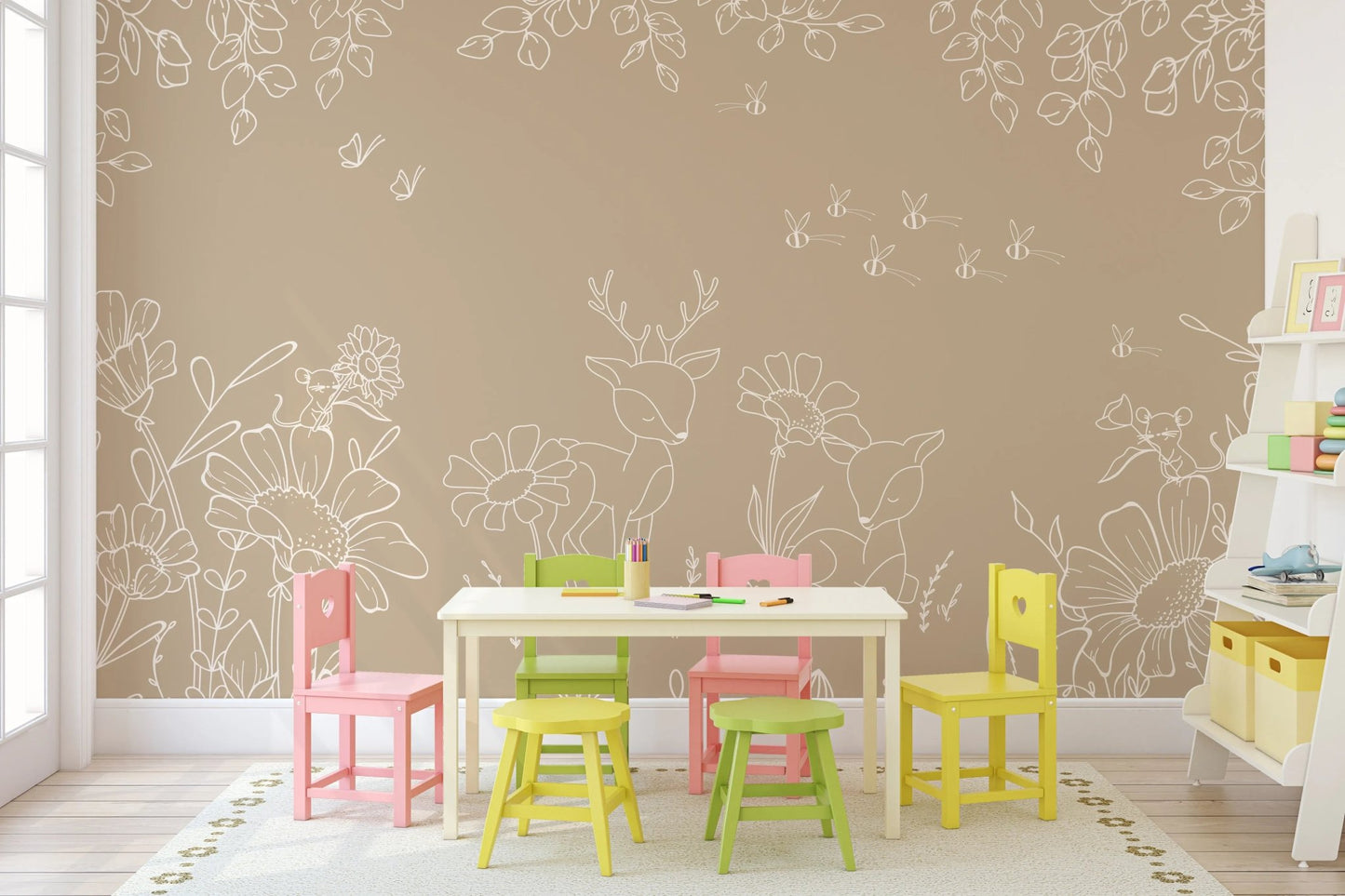 Play area with colorful small chairs against a brown deer wall mural.