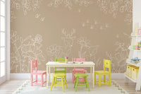 Play area with colorful small chairs against a brown deer wall mural.