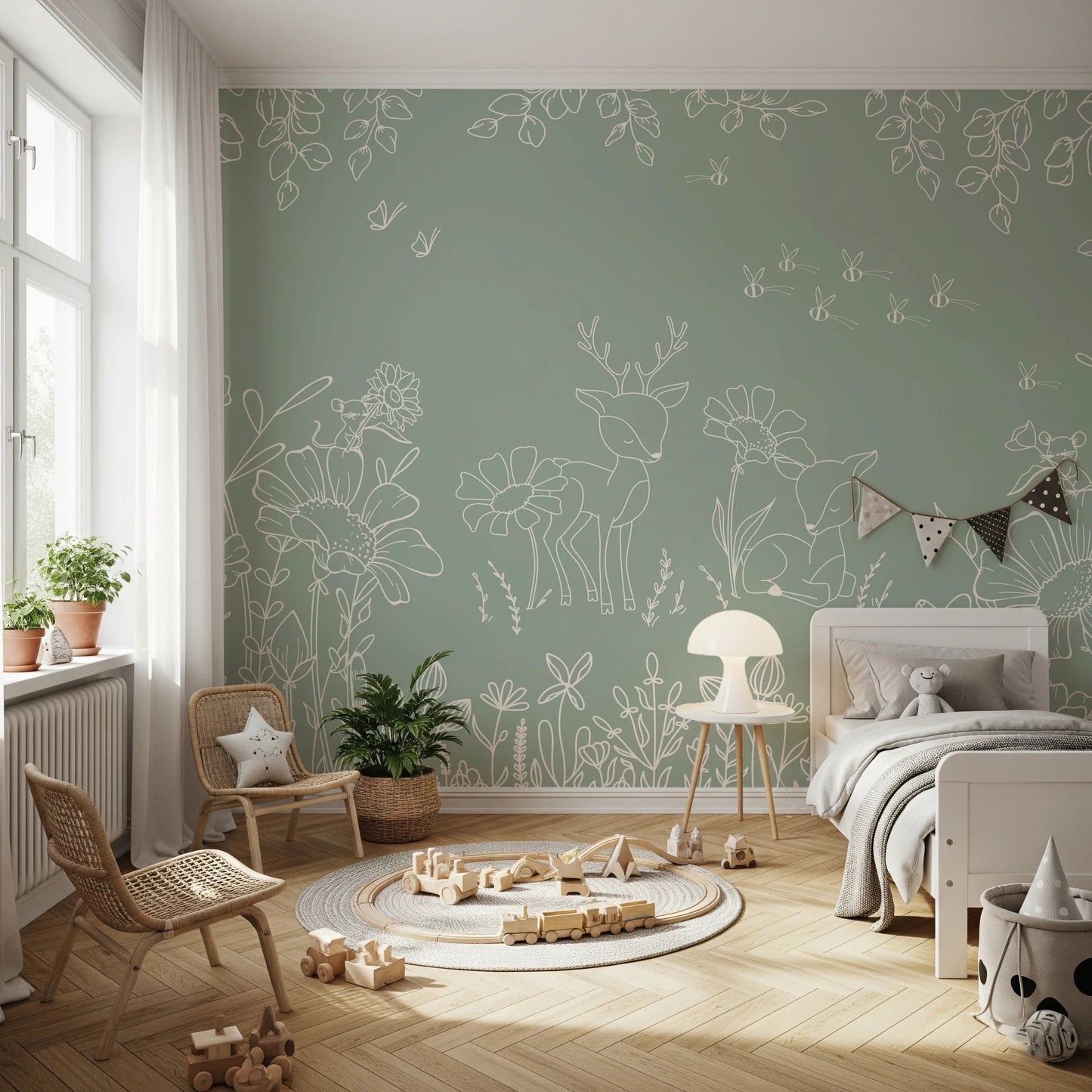 Light green wall mural with animal sketches behind a wooden toddler bed.